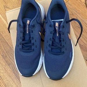 Nike Revolution Navy with Rose/gold/ tannish swosh.. size4.5y for Girl